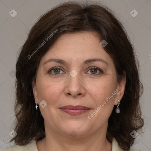 Joyful white adult female with medium  brown hair and brown eyes