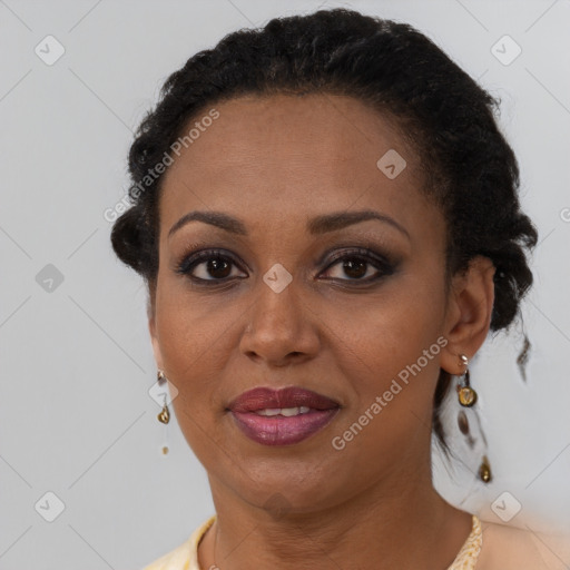 Joyful black young-adult female with short  brown hair and brown eyes