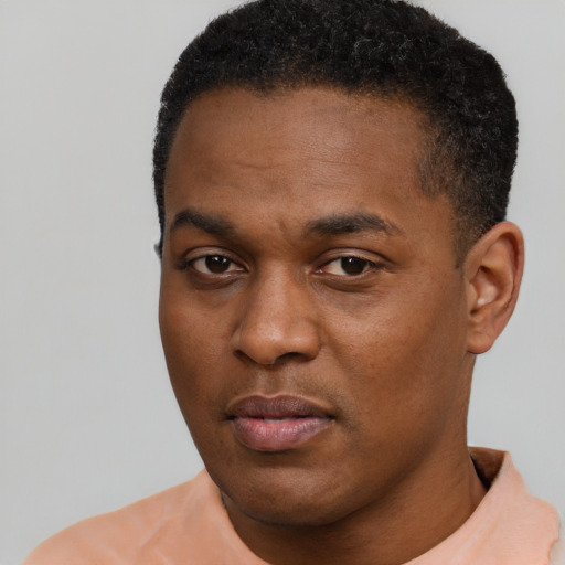 Neutral black young-adult male with short  black hair and brown eyes