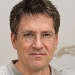 Joyful white middle-aged male with short  brown hair and brown eyes