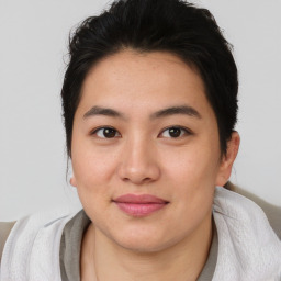 Joyful asian young-adult female with short  brown hair and brown eyes