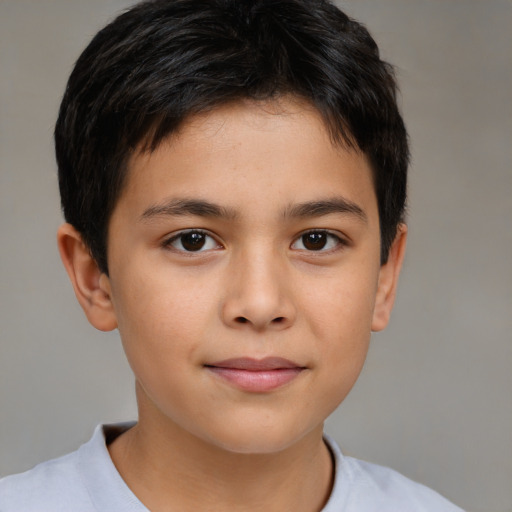 Joyful white child male with short  brown hair and brown eyes