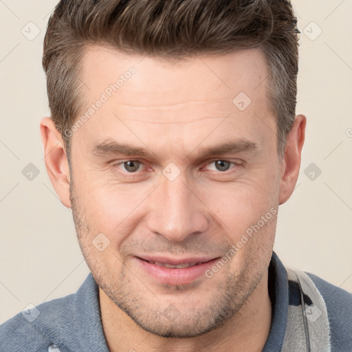 Joyful white adult male with short  brown hair and brown eyes