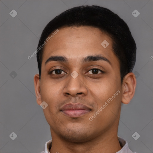 Joyful latino young-adult male with short  brown hair and brown eyes