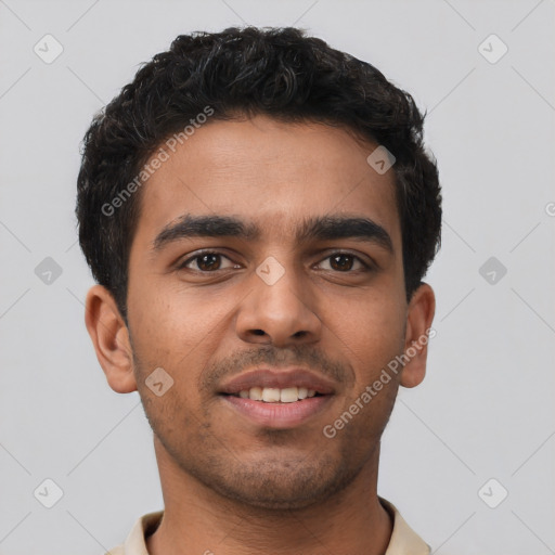 Joyful latino young-adult male with short  brown hair and brown eyes