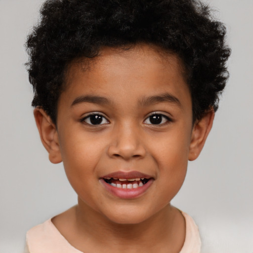 Joyful latino child male with short  brown hair and brown eyes