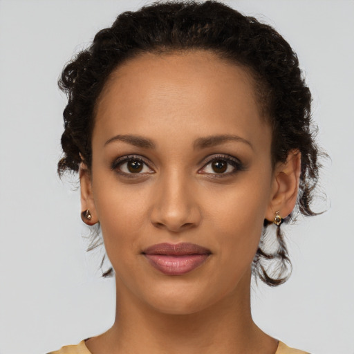Joyful latino young-adult female with short  brown hair and brown eyes