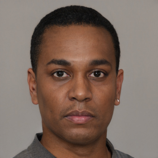 Neutral black young-adult male with short  black hair and brown eyes
