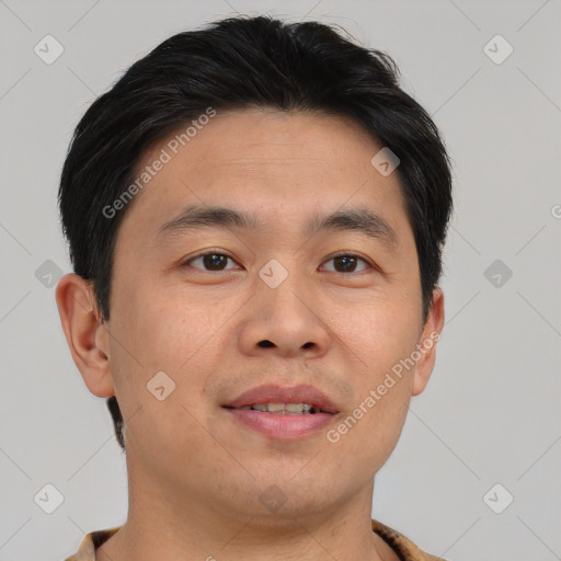 Joyful asian young-adult male with short  brown hair and brown eyes