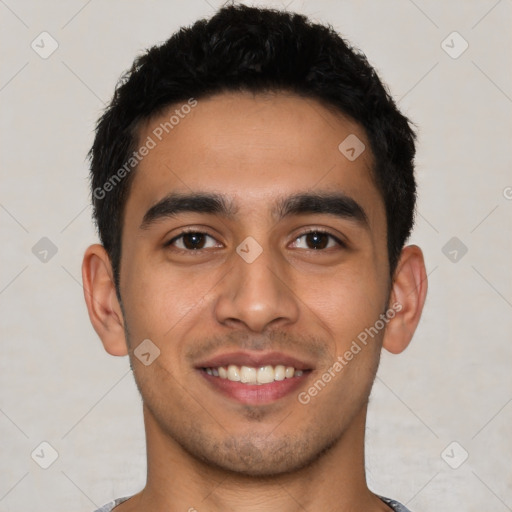 Joyful latino young-adult male with short  black hair and brown eyes