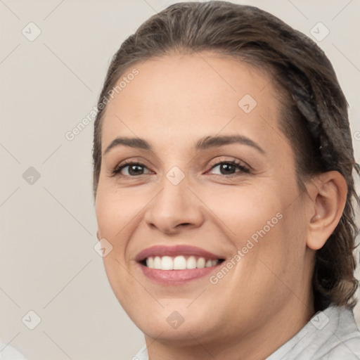 Joyful white young-adult female with medium  brown hair and brown eyes