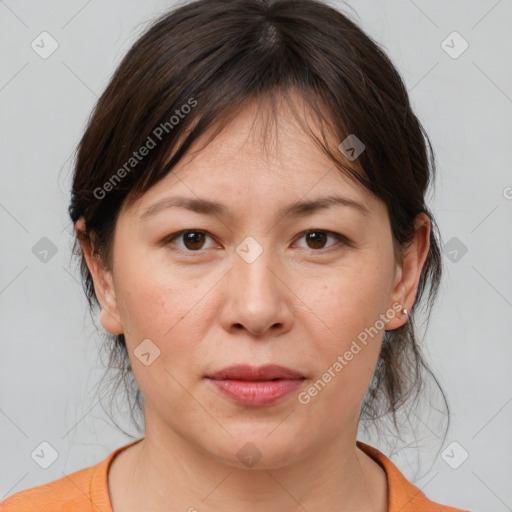 Joyful white adult female with medium  brown hair and brown eyes