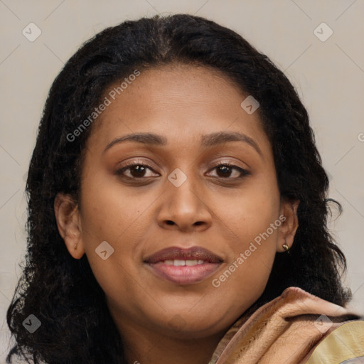 Joyful black young-adult female with long  brown hair and brown eyes