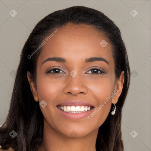 Joyful latino young-adult female with long  brown hair and brown eyes