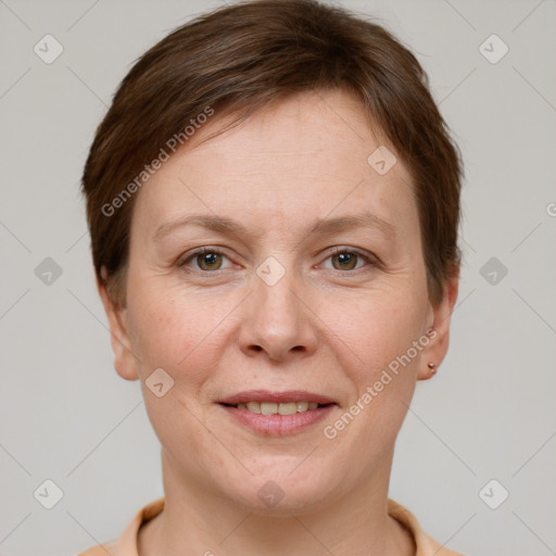 Joyful white adult female with short  brown hair and grey eyes