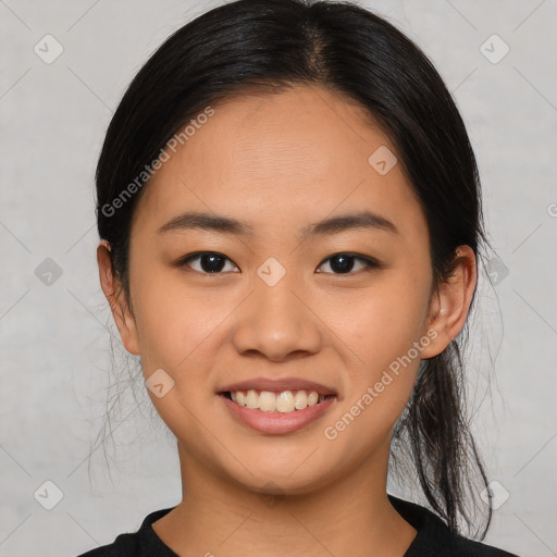 Joyful asian young-adult female with medium  black hair and brown eyes