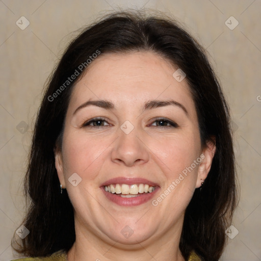 Joyful white adult female with medium  brown hair and brown eyes