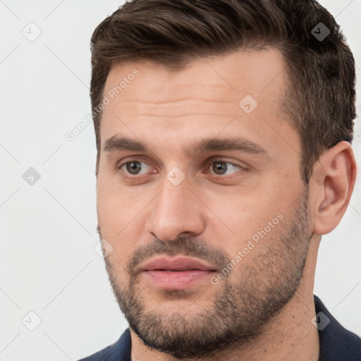 Joyful white young-adult male with short  brown hair and brown eyes