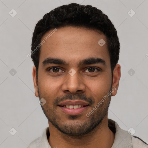 Joyful white young-adult male with short  black hair and brown eyes