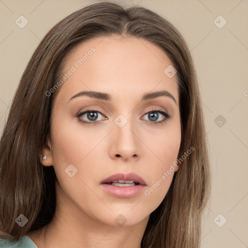 Neutral white young-adult female with long  brown hair and brown eyes