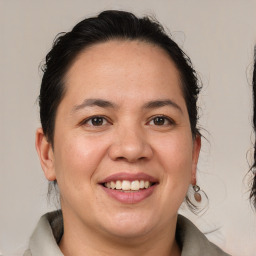 Joyful white adult female with medium  brown hair and brown eyes