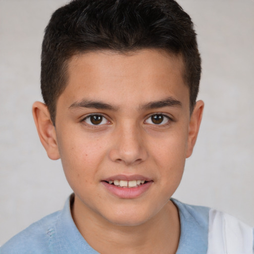 Joyful white child male with short  brown hair and brown eyes