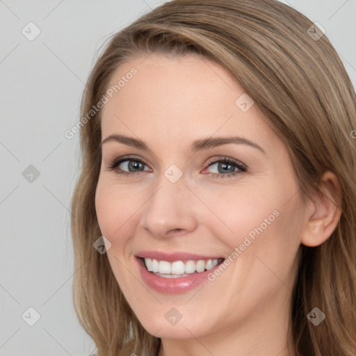 Joyful white young-adult female with long  brown hair and grey eyes