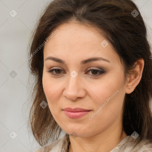 Joyful white adult female with medium  brown hair and brown eyes