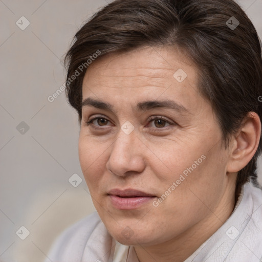 Joyful white adult female with short  brown hair and brown eyes