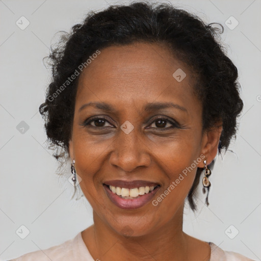 Joyful black adult female with short  brown hair and brown eyes