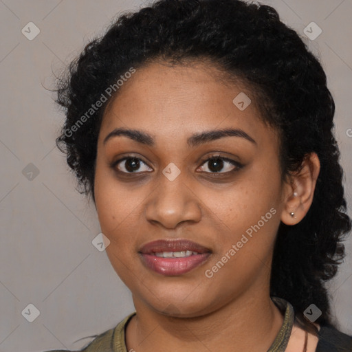 Joyful black young-adult female with long  black hair and brown eyes