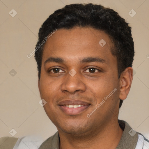 Joyful black young-adult male with short  black hair and brown eyes