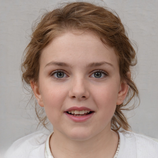 Joyful white child female with medium  brown hair and blue eyes