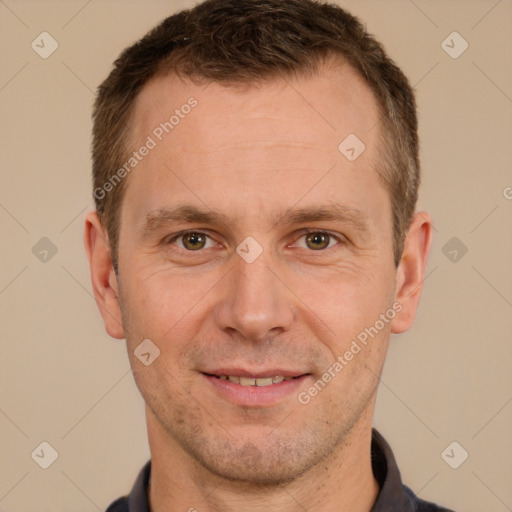 Joyful white adult male with short  brown hair and brown eyes