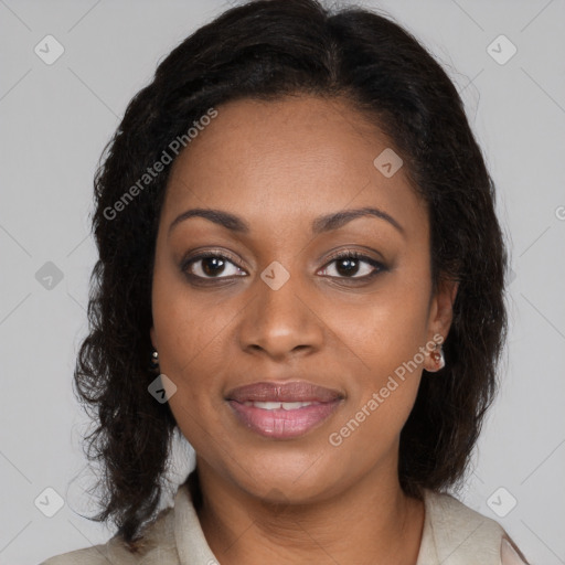 Joyful black young-adult female with long  brown hair and brown eyes