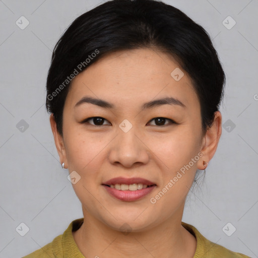 Joyful asian young-adult female with short  brown hair and brown eyes