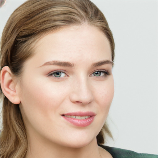 Joyful white young-adult female with long  brown hair and green eyes