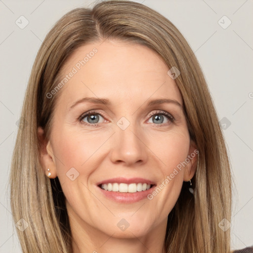 Joyful white adult female with long  brown hair and grey eyes