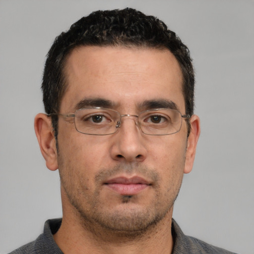 Neutral white young-adult male with short  black hair and brown eyes
