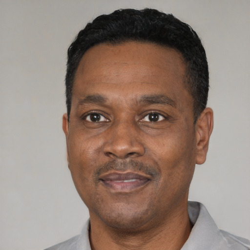 Neutral black adult male with short  black hair and brown eyes