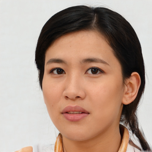 Neutral asian young-adult female with medium  brown hair and brown eyes