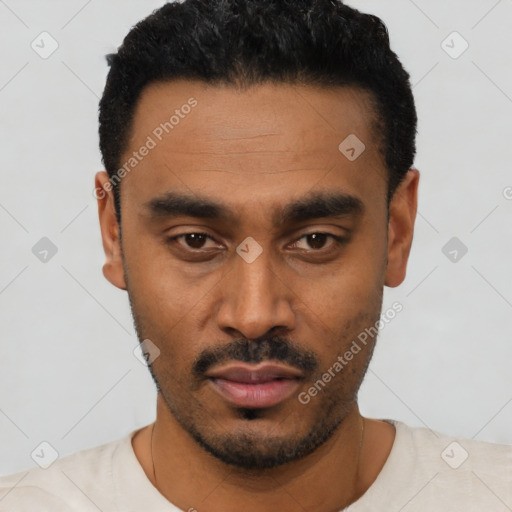 Neutral latino young-adult male with short  black hair and brown eyes
