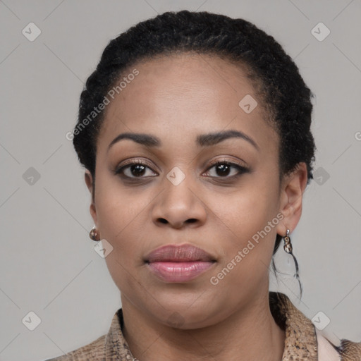 Joyful black young-adult female with short  black hair and brown eyes