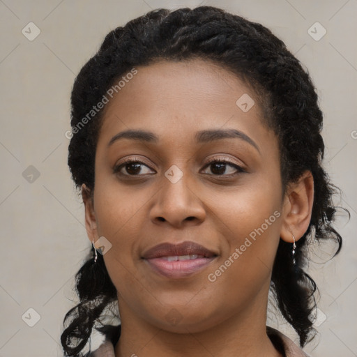 Joyful black young-adult female with medium  black hair and brown eyes