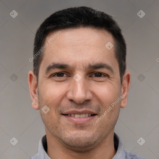 Joyful white adult male with short  brown hair and brown eyes