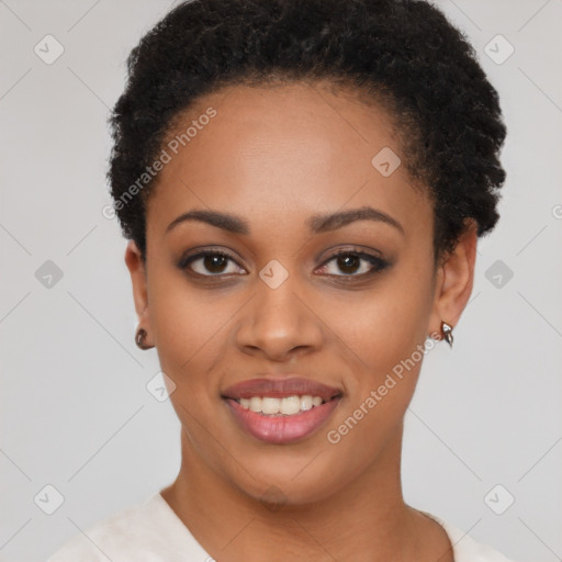 Joyful black young-adult female with short  brown hair and brown eyes