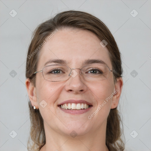 Joyful white adult female with medium  brown hair and grey eyes