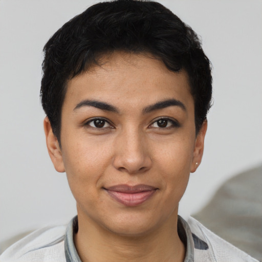 Joyful latino young-adult female with short  brown hair and brown eyes