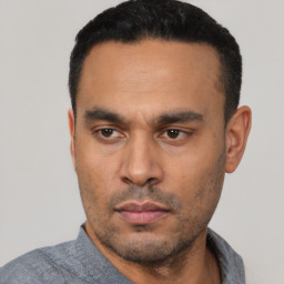 Neutral latino young-adult male with short  black hair and brown eyes