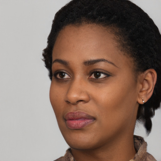 Neutral black young-adult female with short  black hair and brown eyes